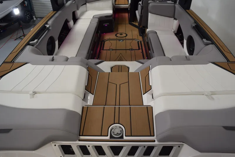 Slide: The Image of Interior of 2021 Supra SE 450 boat with luxurious seating and wood accents. - 16