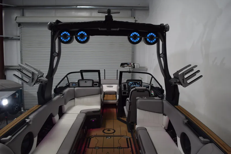 Slide: The Image of 2021 Supra SE 450 boat interior with modern seating and advanced audio system. - 17