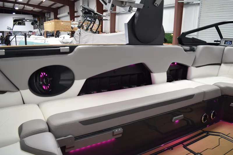 Slide: The Image of 2021 Supra SE 450 boat interior with modern seating and ambient lighting. - 19