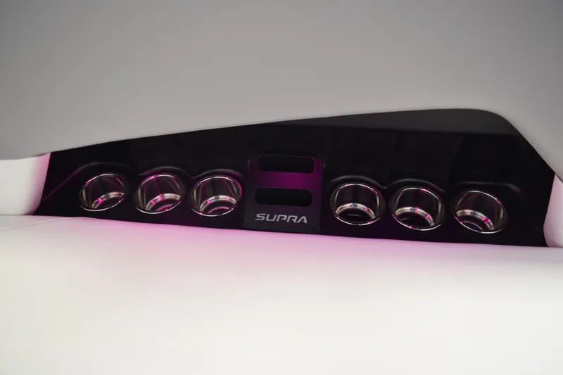 Slide: The Image of 2021 Supra SE 450 interior with illuminated cup holders and sleek design. - 20