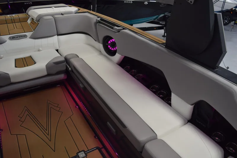Slide: The Image of Luxurious interior of 2021 Supra SE 450 boat with plush seating and ambient lighting. - 22