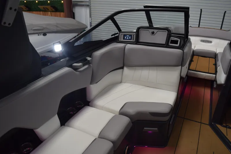 Slide: The Image of 2021 Supra SE 450 boat interior with modern seating and ambient lighting. - 23
