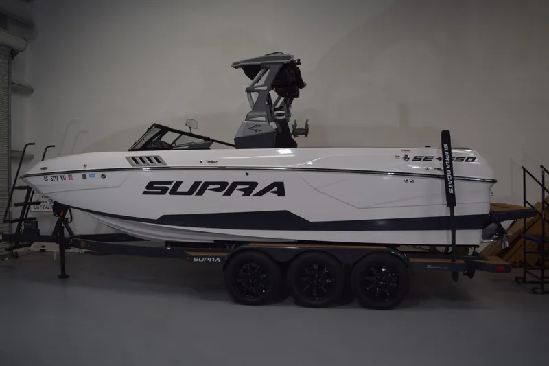 Slide: The Image of Interior of a 2021 Supra SE 450 boat with luxurious seating and stylish design. - 28