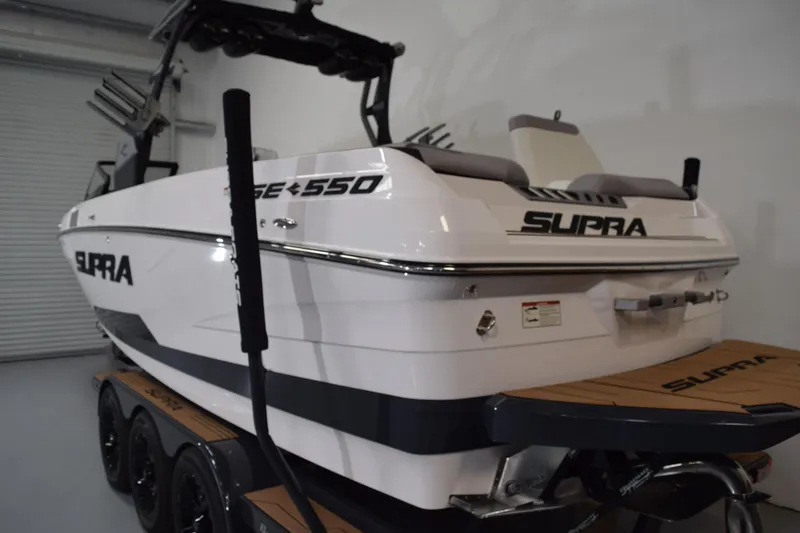 Slide: The Image of 2021 Supra SE 450 boat on trailer, showcasing sleek design and modern features. - 5