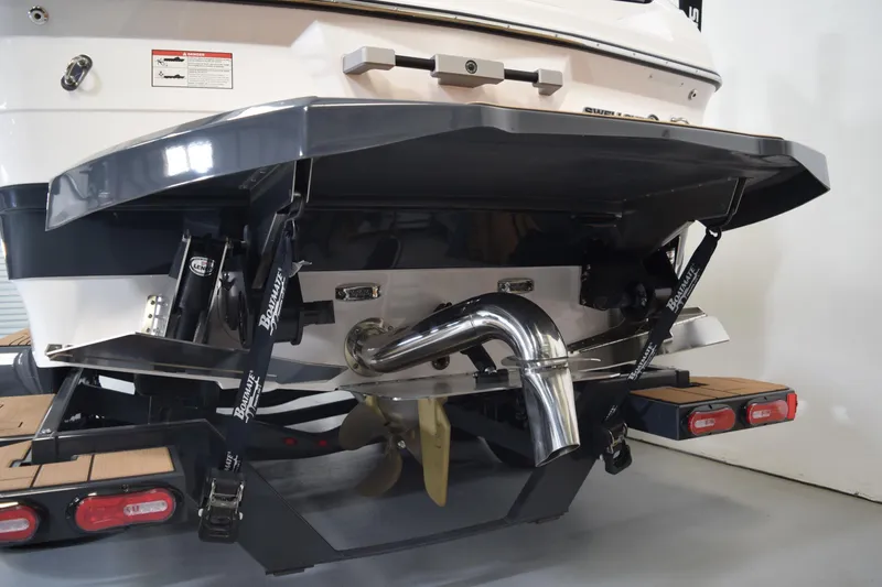 Slide: The Image of Rear view of 2021 Supra SE 450 boat with propeller and exhaust system. - 6