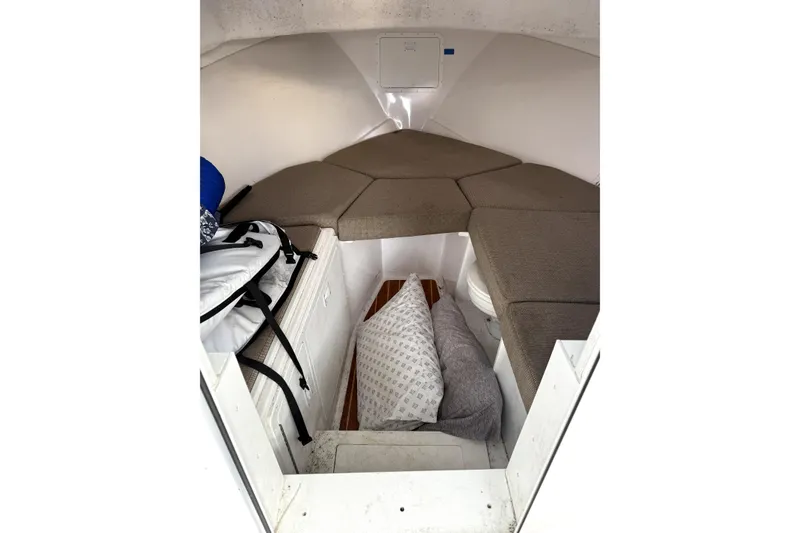 Slide: The Image of 2023 Steiger Craft 31 Fisherman cabin interior with cushions and storage. - 8