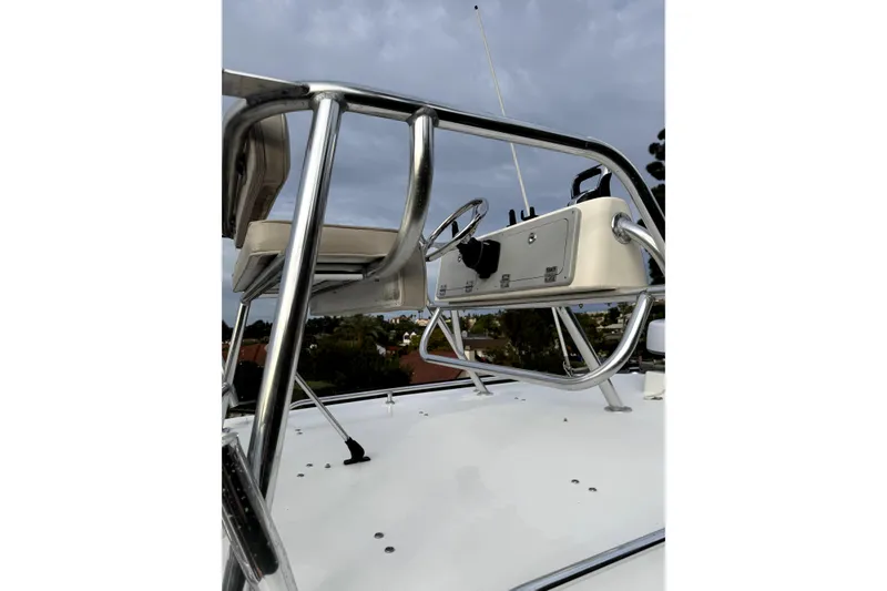 Slide: The Image of 2023 Steiger Craft 31 Fisherman boat helm with stainless steel frame under cloudy sky. - 9