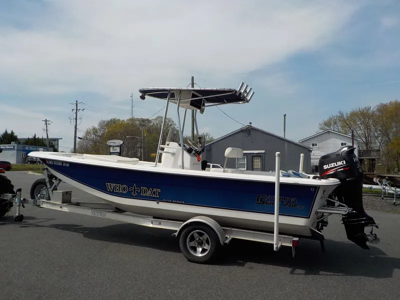 Slide: The Image of 2010 Carolina Skiff Elite Series DLV 218 on trailer, Suzuki motor. - 4