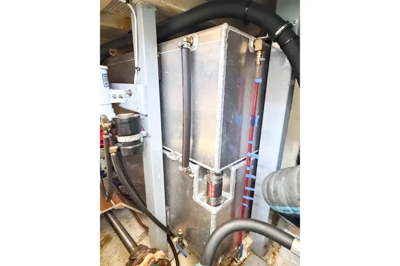 Slide: The Image of Engine room of 1991 Grand Banks 36 Classic, showcasing fuel system components and piping. - 101