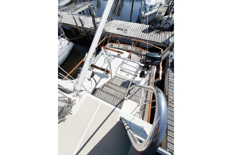 Slide: The Image of 1991 Grand Banks 36 Classic yacht docked, showcasing deck and railing details. - 16