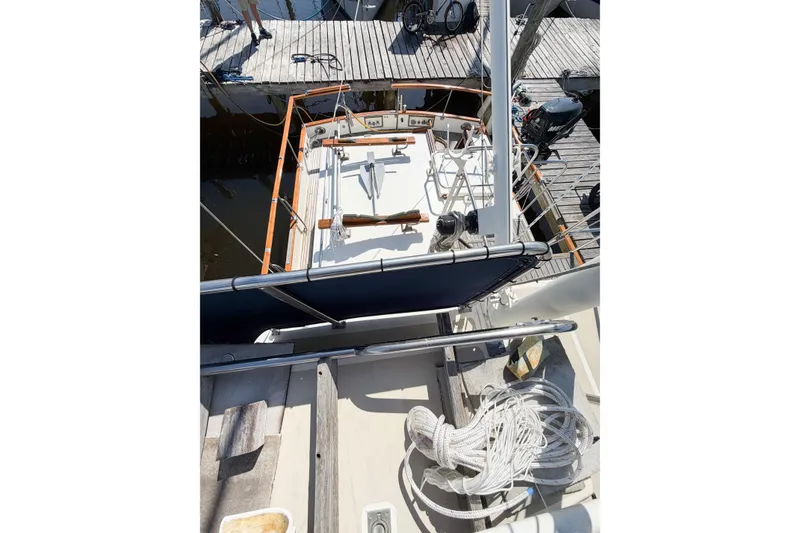 Slide: The Image of 1991 Grand Banks 36 Classic yacht docked, showcasing deck and nautical equipment. - 22