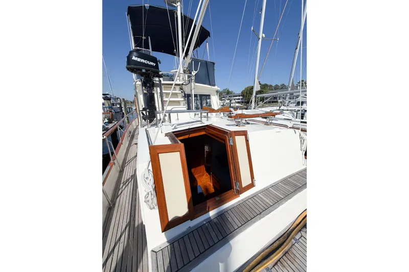 Slide: The Image of 1991 Grand Banks 36 Classic yacht deck with open hatch and visible rigging. - 27