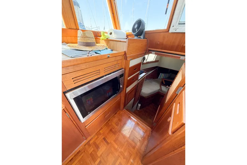 Slide: The Image of Interior of 1991 Grand Banks 36 Classic yacht with wood finish and microwave. - 44