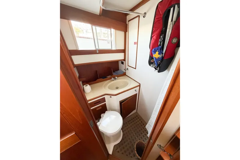 Slide: The Image of Bathroom interior of 1991 Grand Banks 36 Classic yacht, featuring sink and toilet. - 45