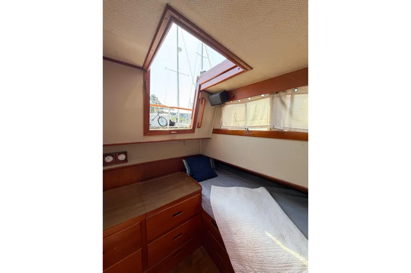 Slide: The Image of Cozy cabin interior of 1991 Grand Banks 36 Classic yacht with wooden furnishings. - 58