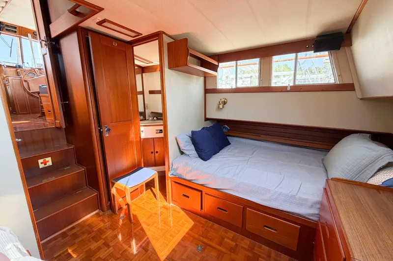 Slide: The Image of Cozy cabin interior of 1991 Grand Banks 36 Classic yacht with wooden furnishings and bed. - 59