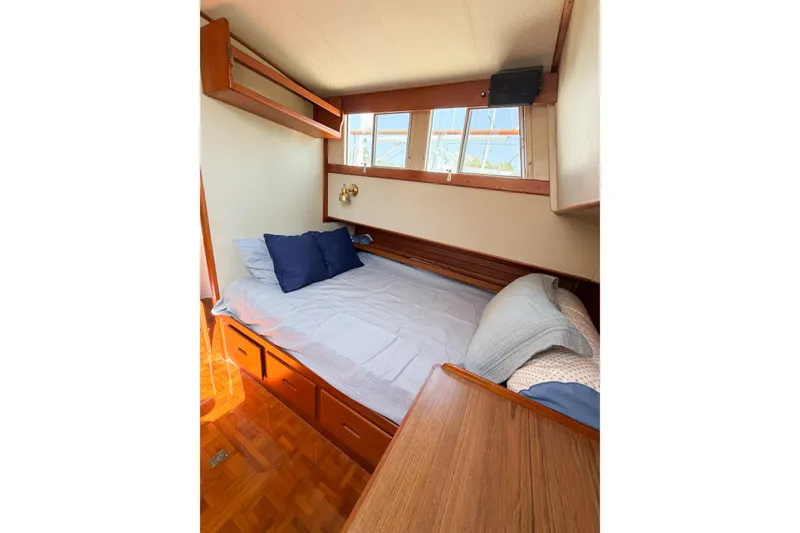 Slide: The Image of Cozy cabin interior of 1991 Grand Banks 36 Classic with bed and wooden furnishings. - 60