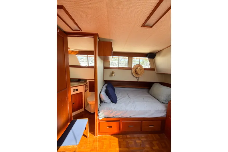 Slide: The Image of Cozy cabin interior of 1991 Grand Banks 36 Classic yacht with bed and wooden furnishings. - 61