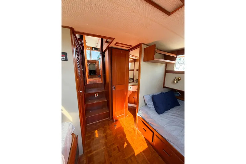 Slide: The Image of Interior of 1991 Grand Banks 36 Classic yacht, featuring cozy cabin with wooden finishes. - 62