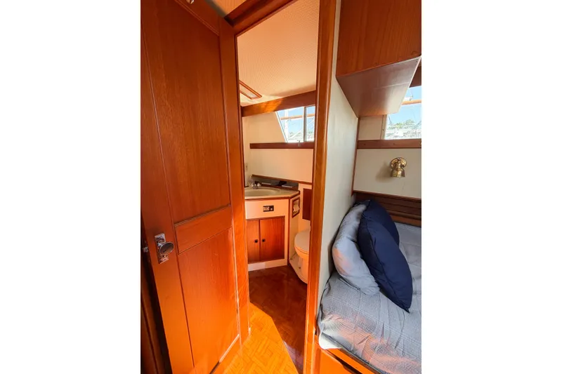 Slide: The Image of Interior of 1991 Grand Banks 36 Classic yacht, featuring cozy cabin and bathroom. - 63