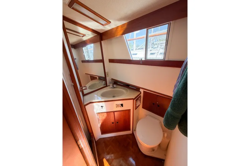 Slide: The Image of Bathroom interior of 1991 Grand Banks 36 Classic yacht, featuring sink and toilet. - 64