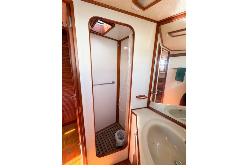 Slide: The Image of Bathroom interior of 1991 Grand Banks 36 Classic yacht, featuring shower and sink. - 65