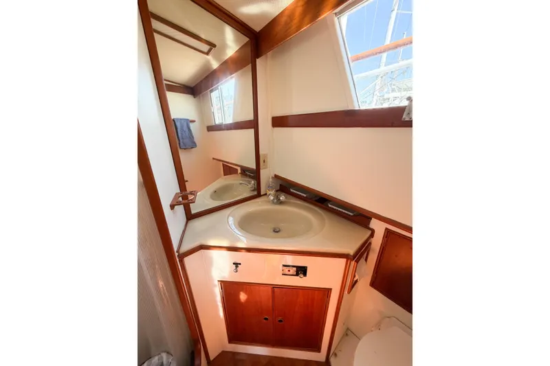 Slide: The Image of Bathroom interior of 1991 Grand Banks 36 Classic yacht, featuring sink and mirror. - 67