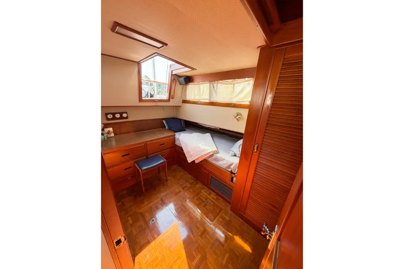 Slide: The Image of Cozy cabin interior of 1991 Grand Banks 36 Classic yacht with wood furnishings. - 68