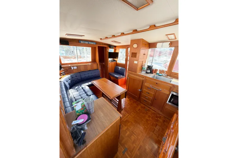 Slide: The Image of Interior of 1991 Grand Banks 36 Classic yacht with wood finish and cozy seating area. - 74
