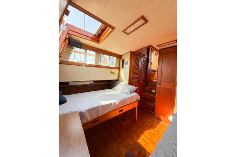 Slide: The Image of Cozy cabin interior of 1991 Grand Banks 36 Classic yacht with wooden furnishings. - 79