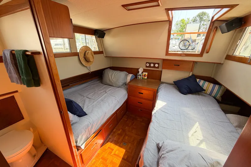 Slide: The Image of Cozy cabin interior of 1991 Grand Banks 36 Classic yacht with twin beds and wooden furnishings. - 80