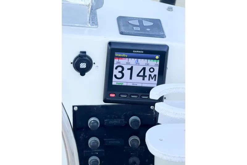 Slide: The Image of Garmin navigation display on 1991 Grand Banks 36 Classic boat dashboard. - 83