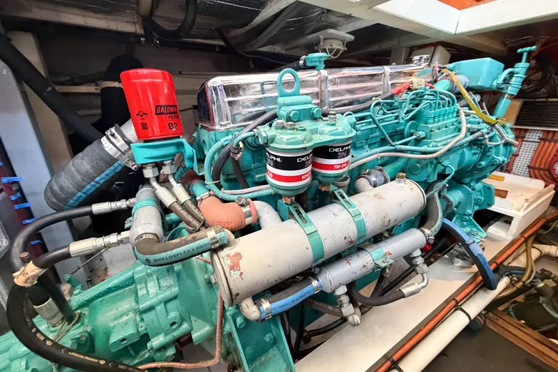 Slide: The Image of Engine room of a 1991 Grand Banks 36 Classic, showcasing detailed mechanical components. - 88