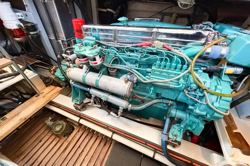 Slide: The Image of Engine room of a 1991 Grand Banks 36 Classic, showcasing a well-maintained marine engine. - 93