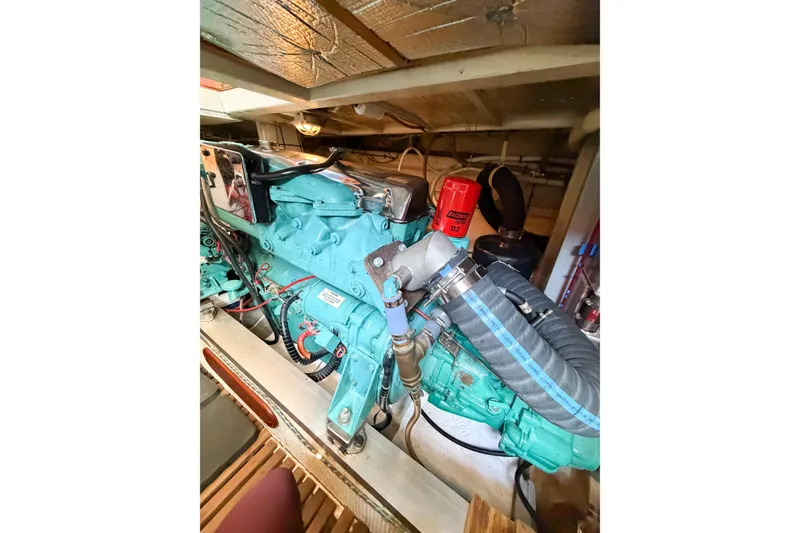 Slide: The Image of Engine room of a 1991 Grand Banks 36 Classic yacht, showcasing mechanical components. - 96