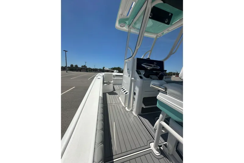 Slide: The Image of 2021 Caymas 28 HB boat interior with sleek design and modern controls. - 13