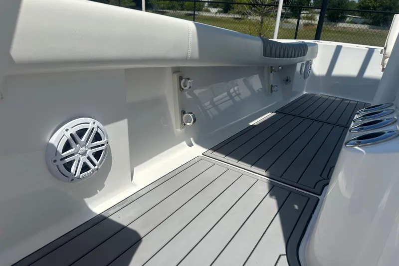Slide: The Image of Interior view of 2021 Caymas 28 HB boat with sleek flooring and speaker system. - 18