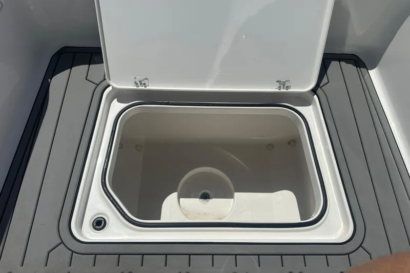 Slide: The Image of Open storage compartment on 2021 Caymas 28 HB boat deck. - 27