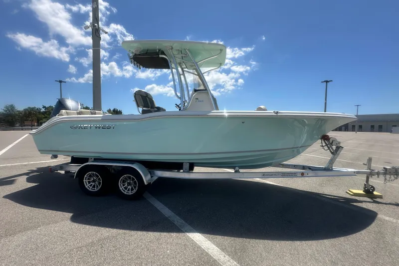Slide: The Image of 2021 Caymas 28 HB boat on trailer under clear blue sky. - 35