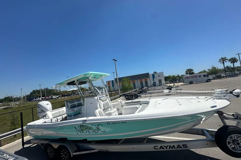 Slide: The Image of 2021 Caymas 28 HB boat on trailer in sunny parking lot. - 4