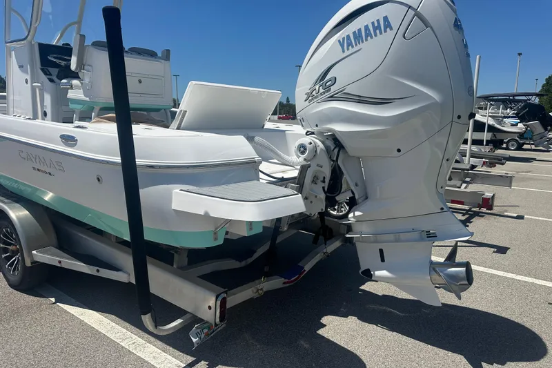Slide: The Image of 2021 Caymas 28 HB boat with Yamaha engine on trailer in parking lot. - 7
