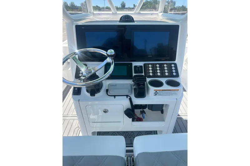 Slide: The Image of Helm of 2021 Caymas 28 HB boat with steering wheel and electronic displays. - 8