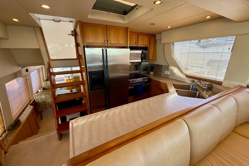 Slide: The Image of Luxurious interior of 2001 Pacific Mariner 65 Motoryacht with elegant seating and waterfront view. - 11