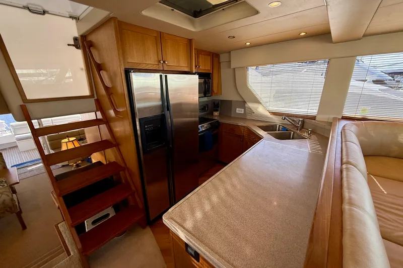 Slide: The Image of Luxurious interior of 2001 Pacific Mariner 65 Motoryacht with elegant furnishings and wood accents. - 12