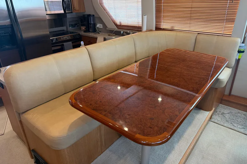 Slide: The Image of Luxurious interior of 2001 Pacific Mariner 65 Motoryacht with elegant furnishings and wood accents. - 13