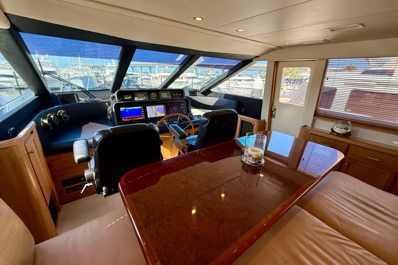 Slide: The Image of Luxurious interior of 2001 Pacific Mariner 65 Motoryacht with plush seating and elegant decor. - 14