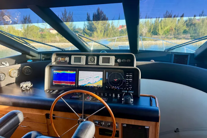 Slide: The Image of Interior of 2001 Pacific Mariner 65 Motoryacht with elegant wood finish and staircase. - 16