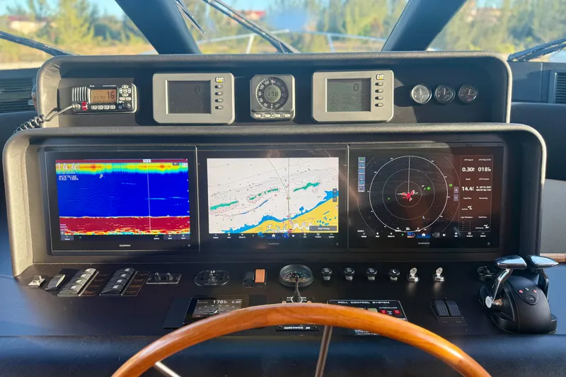 Slide: The Image of Luxurious interior of a 2001 Pacific Mariner 65 Motoryacht with helm and seating area. - 17