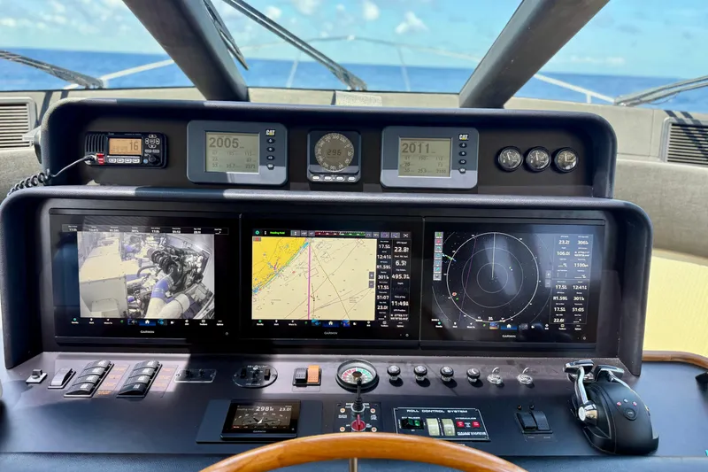 Slide: The Image of Cockpit of 2001 Pacific Mariner 65 Motoryacht with navigation screens and steering wheel. - 23