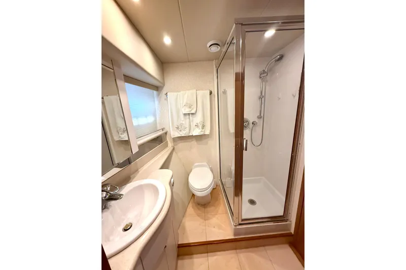 Slide: The Image of Control panel of a 2001 Pacific Mariner 65 Motoryacht with navigation and monitoring screens. - 25